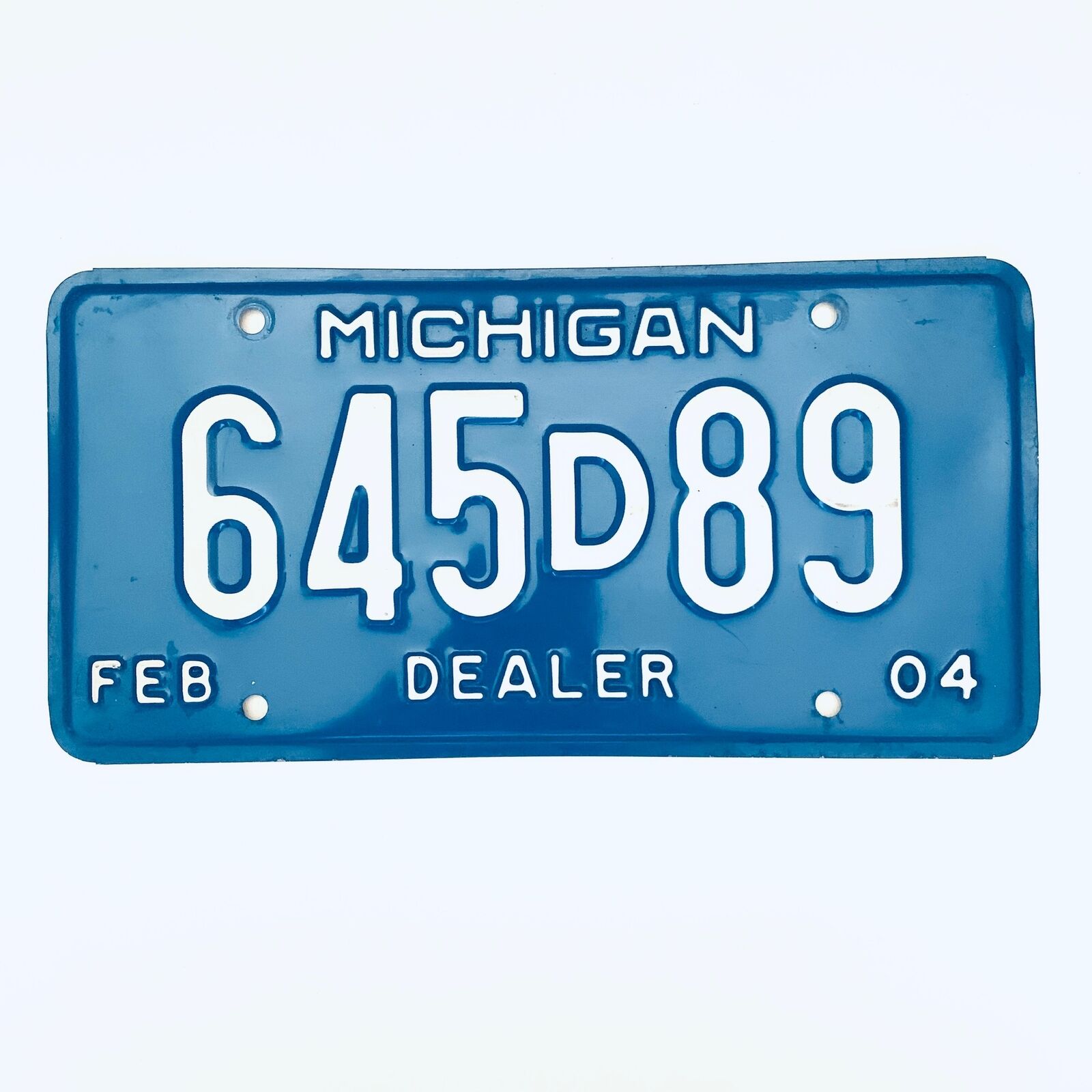 2004 United States Michigan Base Dealer License Plate 645d89